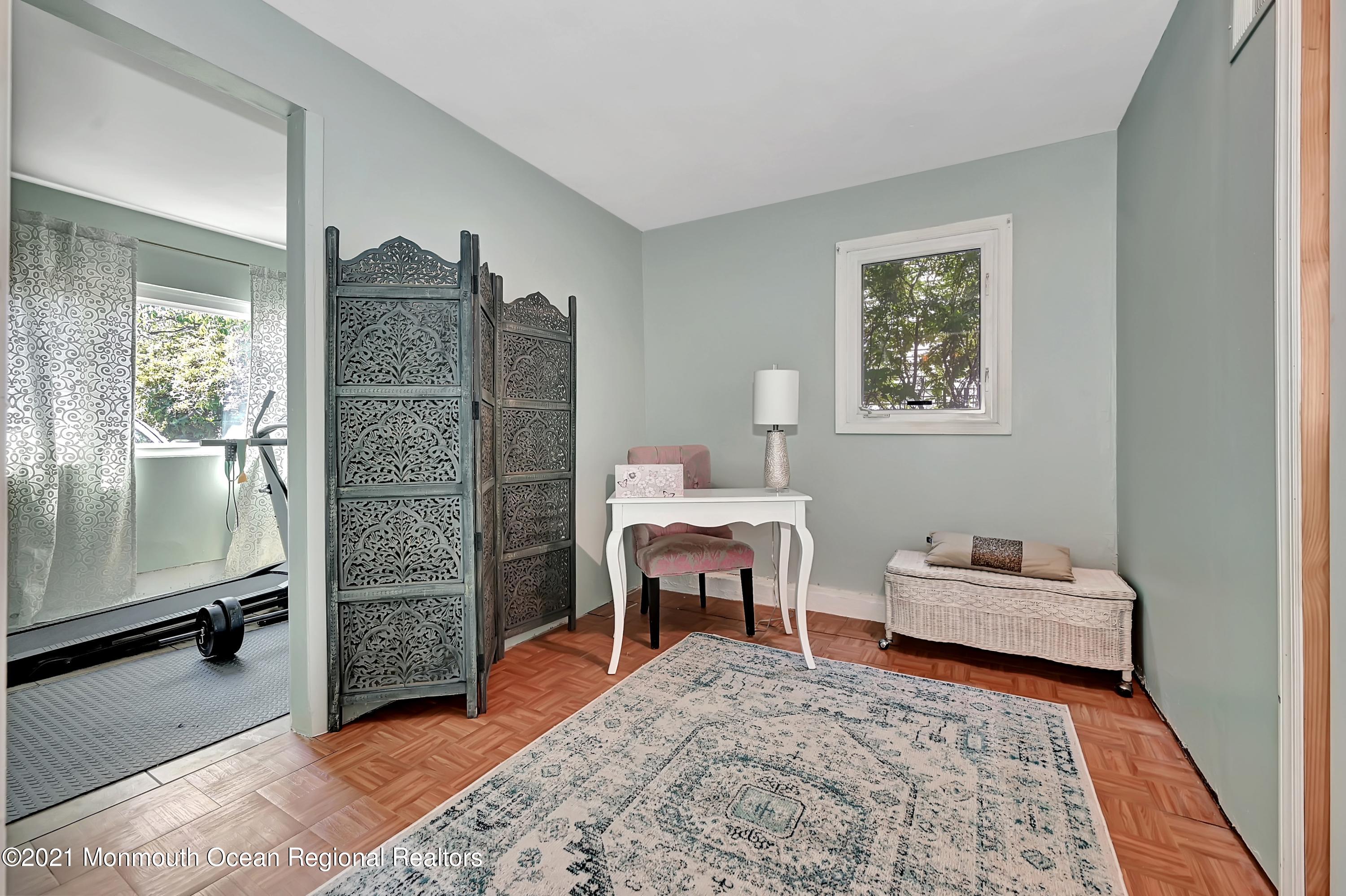 64 Bethany Road Holmdel, NJ 07733 - Photo 22 of 36 a bedroom with furniture and a rug