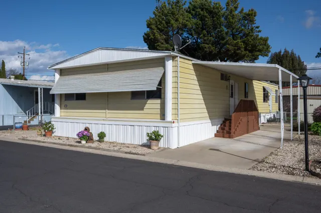 a front view of a house with garage