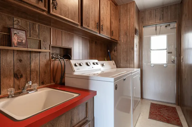 a bathroom with a sink a mirror and a bathtub