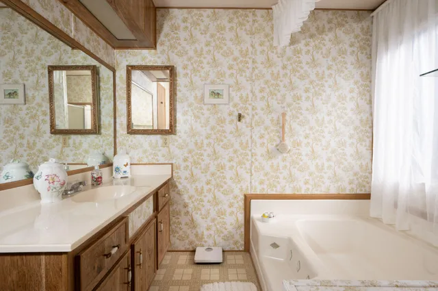 a bathroom with a sink and a mirror