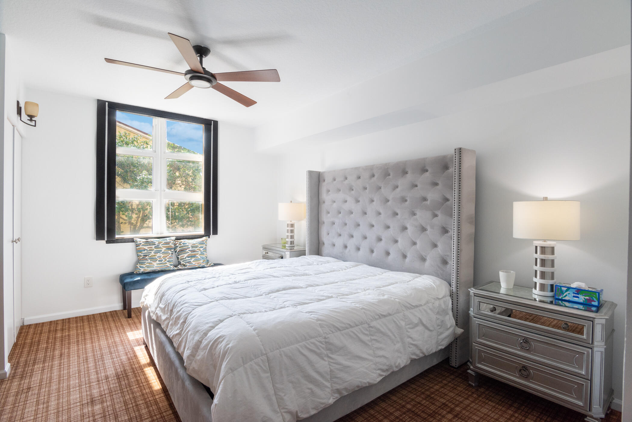 403 South Sapodilla Avenue, Unit 207 West Palm Beach, FL 33401 - Photo 11 of 32 a bedroom with a bed and a window