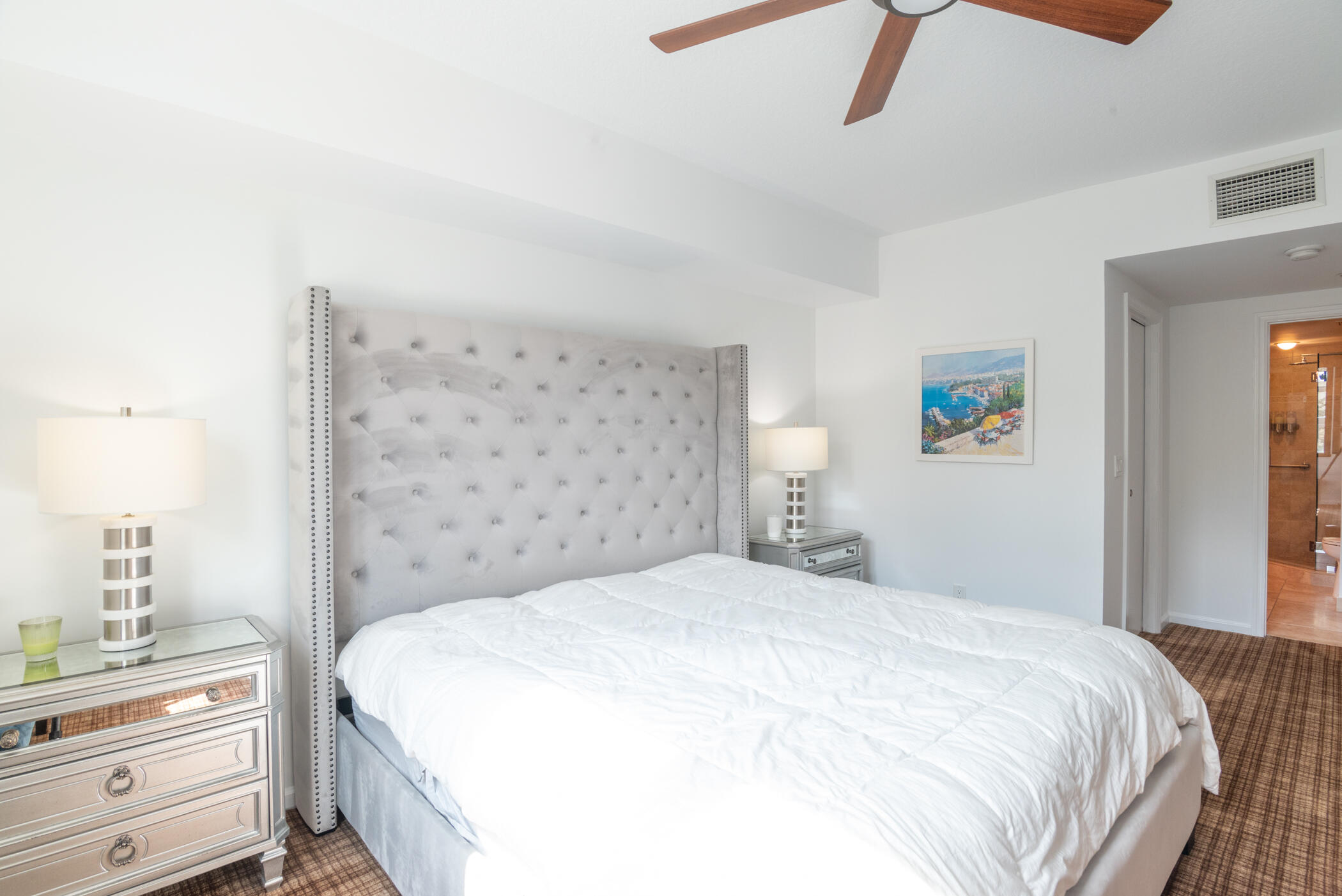 403 South Sapodilla Avenue, Unit 207 West Palm Beach, FL 33401 - Photo 12 of 32 a bedroom with a bed and a window