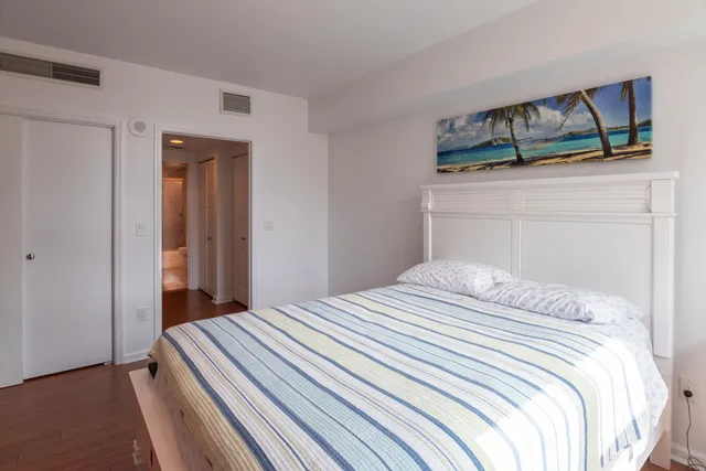 a bedroom with a bed and closet