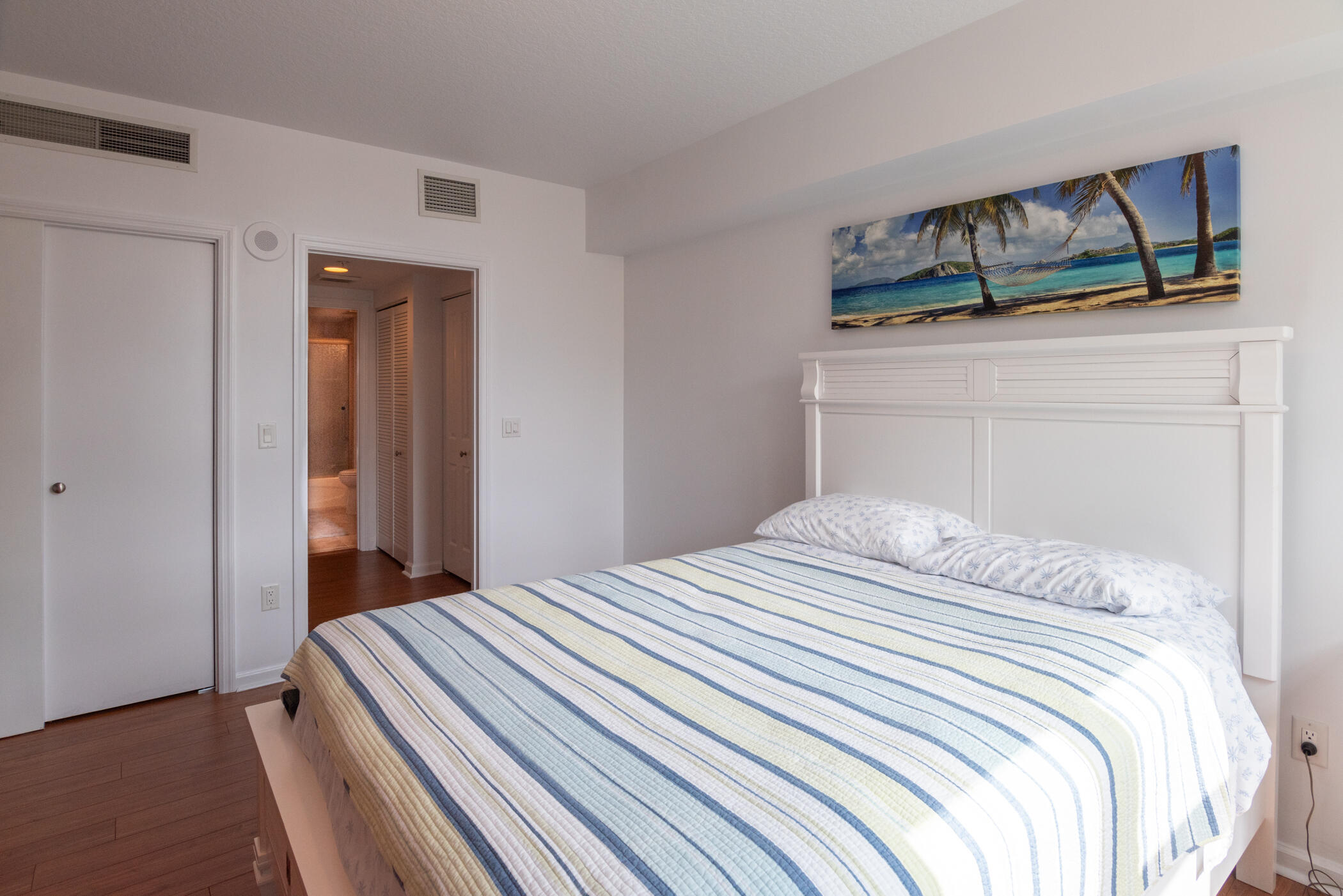 403 South Sapodilla Avenue, Unit 207 West Palm Beach, FL 33401 - Photo 18 of 32 a bedroom with a bed and closet