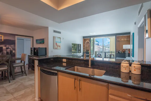 a kitchen with granite countertop a sink and a counter top space