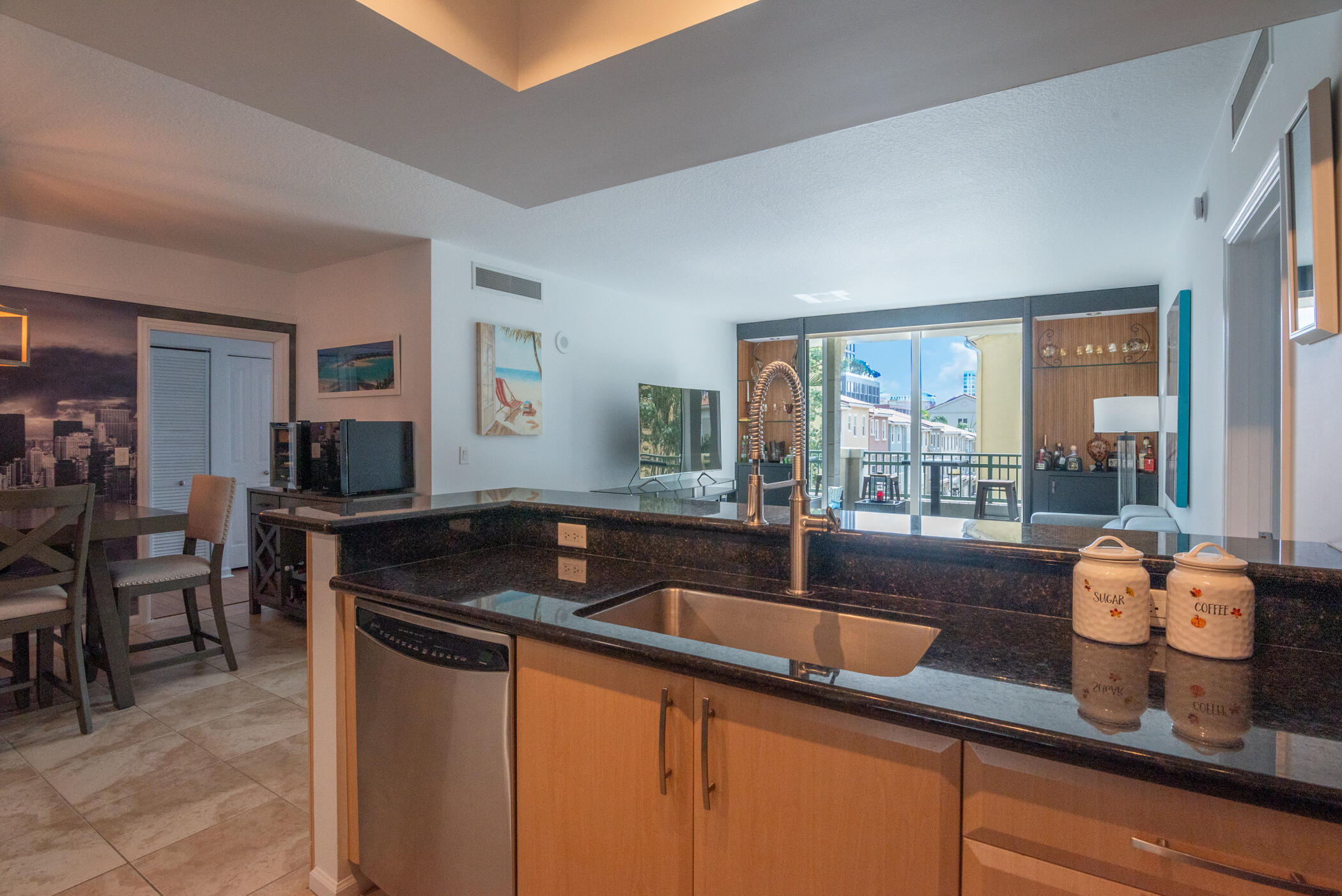 403 South Sapodilla Avenue, Unit 207 West Palm Beach, FL 33401 - Photo 3 of 32 a kitchen with granite countertop a sink and a counter top space