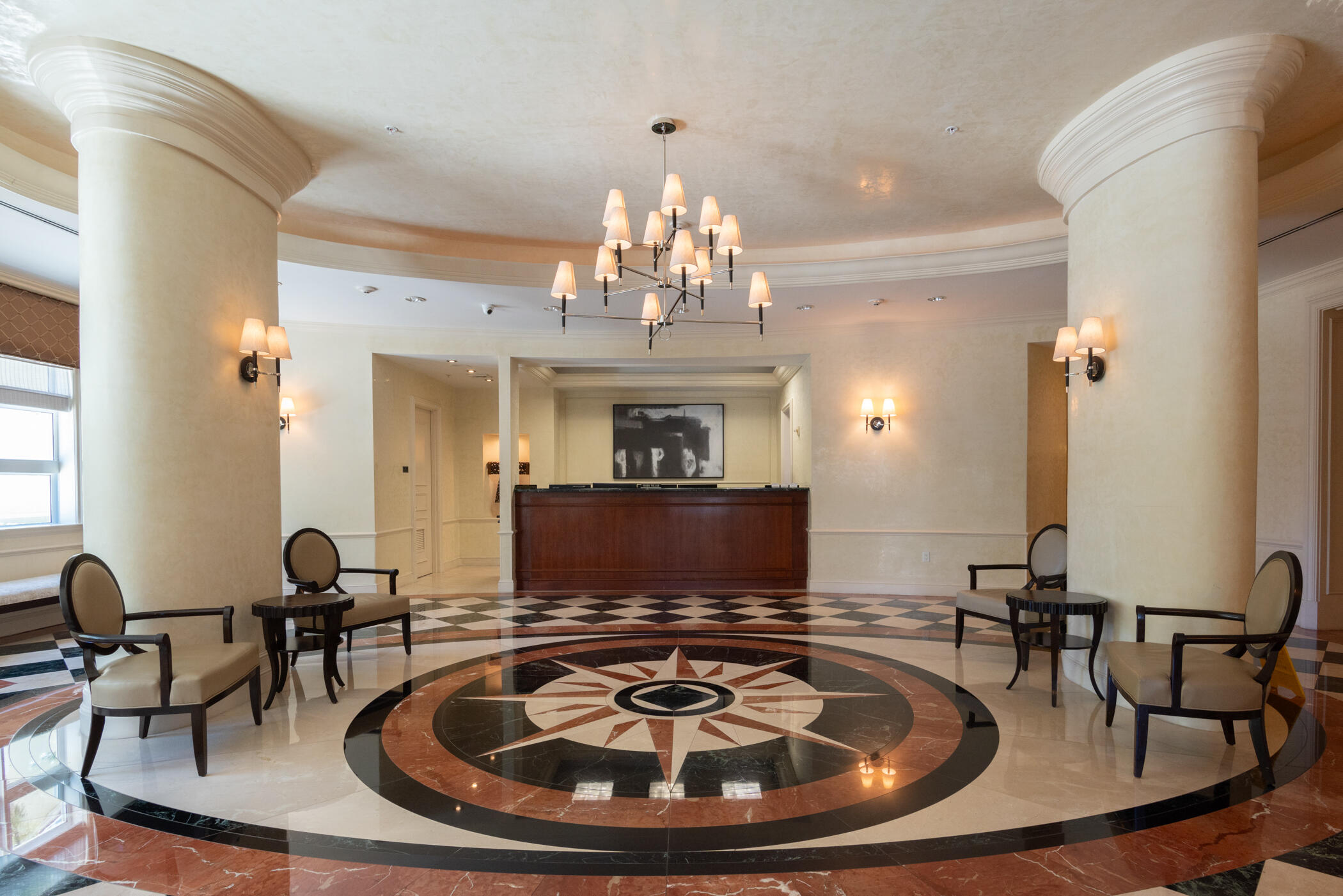 403 South Sapodilla Avenue, Unit 207 West Palm Beach, FL 33401 - Photo 31 of 32 a living room with furniture a chandelier and a fireplace