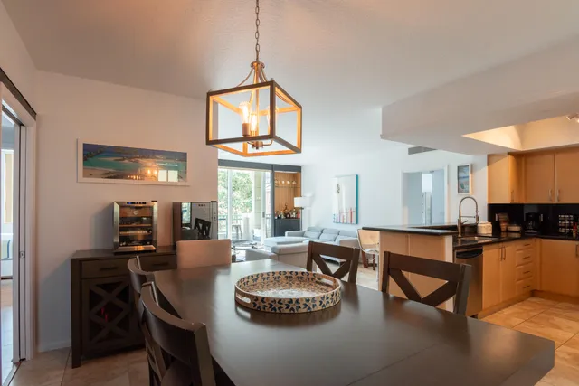 a kitchen with a dining table and chairs