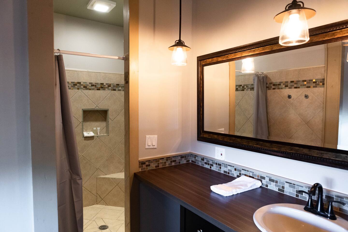 1901 Harmon Hills Road Dripping Springs, TX 78620 - Photo 4 of 27 a bathroom with a granite countertop sink and a mirror