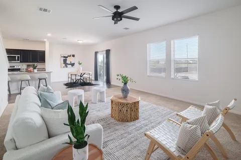 a kitchen island with granite countertop a sink and dishwasher with wooden floor