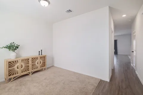 a living room with furniture potted plant and a window
