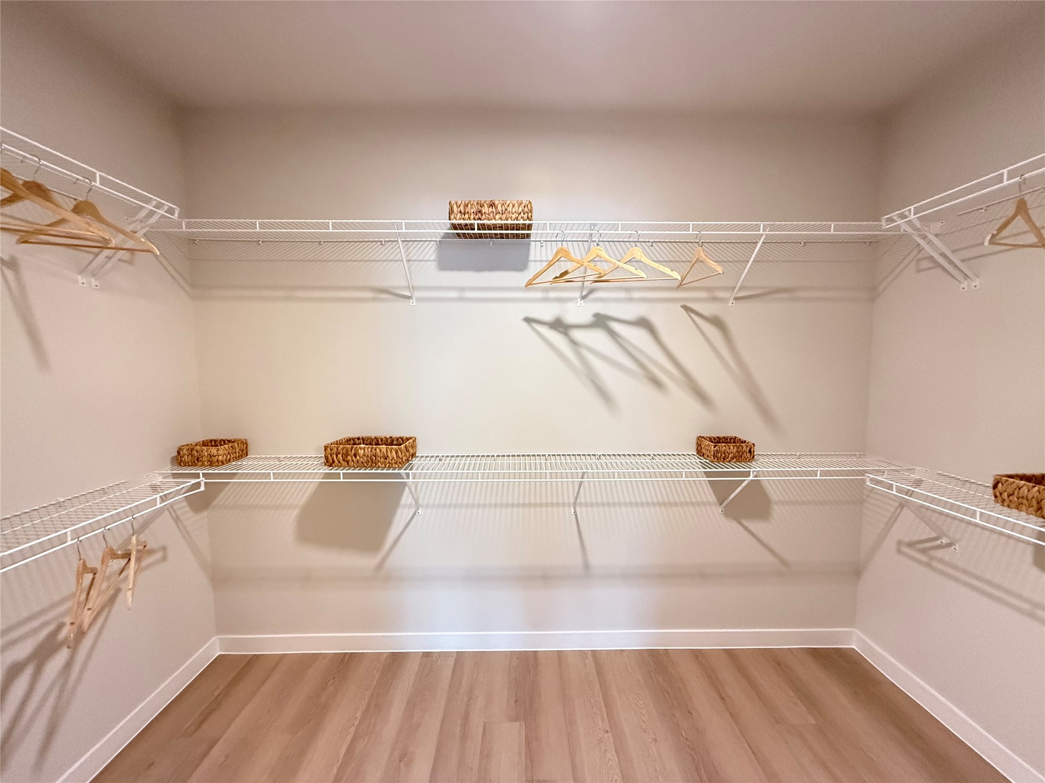 19939 Longenbaugh Road, Unit B6325 Cypress, TX 77433 - Photo 7 of 13 a view of walk in closet with empty racks