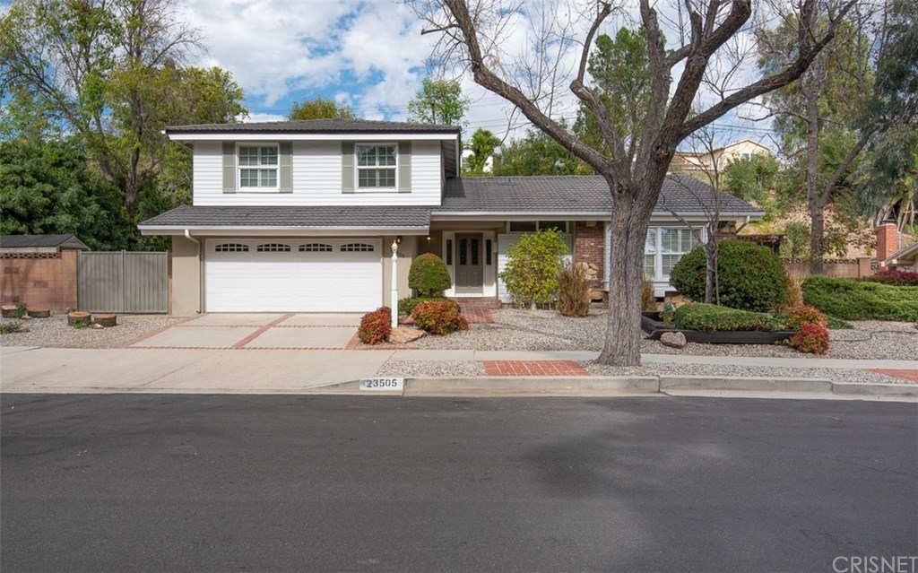Impressive curb appeal on expansive 11,203 s.f. lot with RV potential through west side gate
