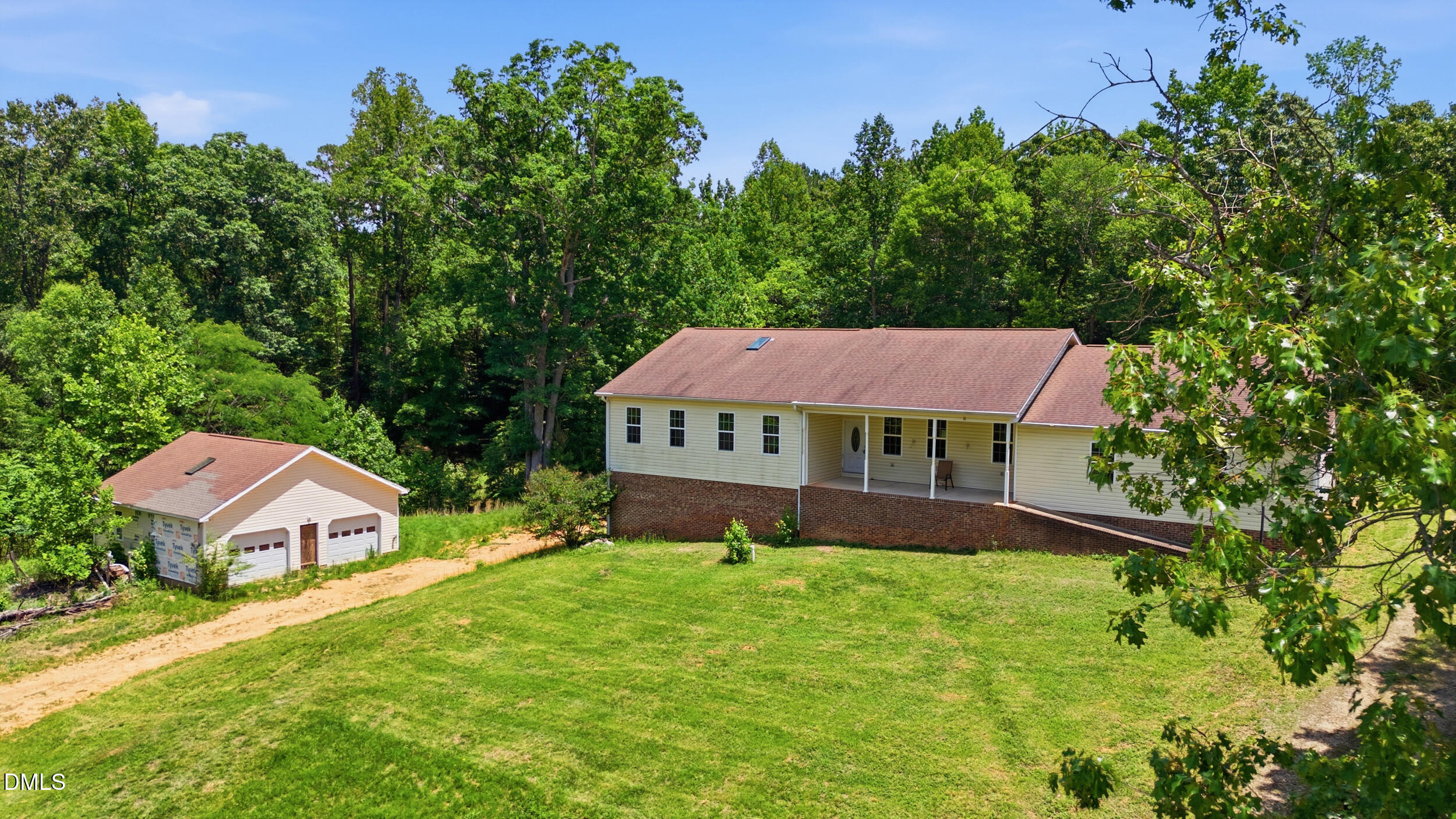 129 Shaman Drive Spring Hope, NC 27882 - Photo 2 of 43 a front view of a house with garden