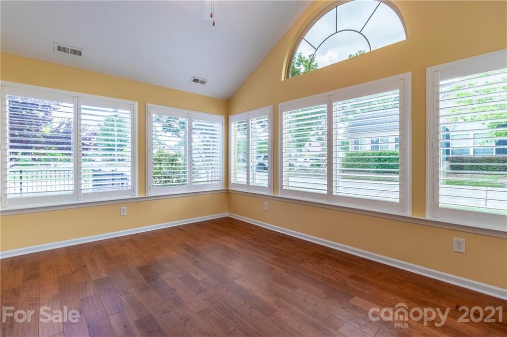846 Ledgestone Court Tega Cay, SC 29708 - Photo 14 of 41 a view of room with wooden floor and windows