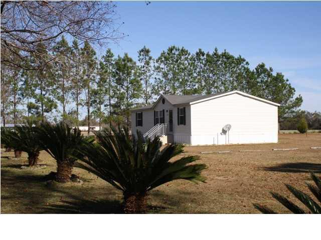 6121 Buckward Road Baker, FL 32531 - Photo 1 of 14 a view of a backyard