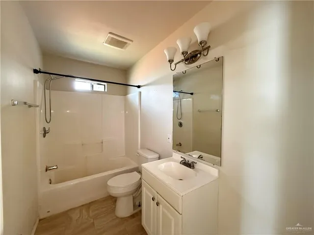 a bathroom with a toilet a sink and a bathtub