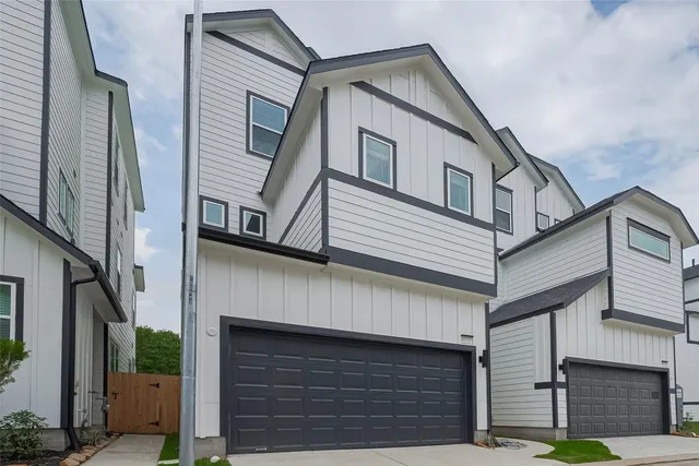 a front view of a house with garage