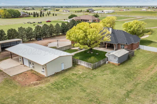 a view of a swimming pool with a yard