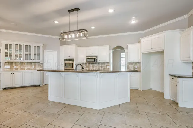a kitchen with stainless steel appliances granite countertop a sink and dishwasher