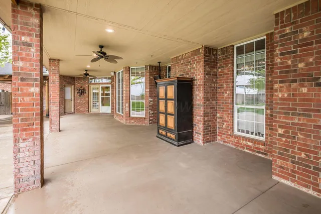 a kitchen with stainless steel appliances kitchen island granite countertop a refrigerator and a stove