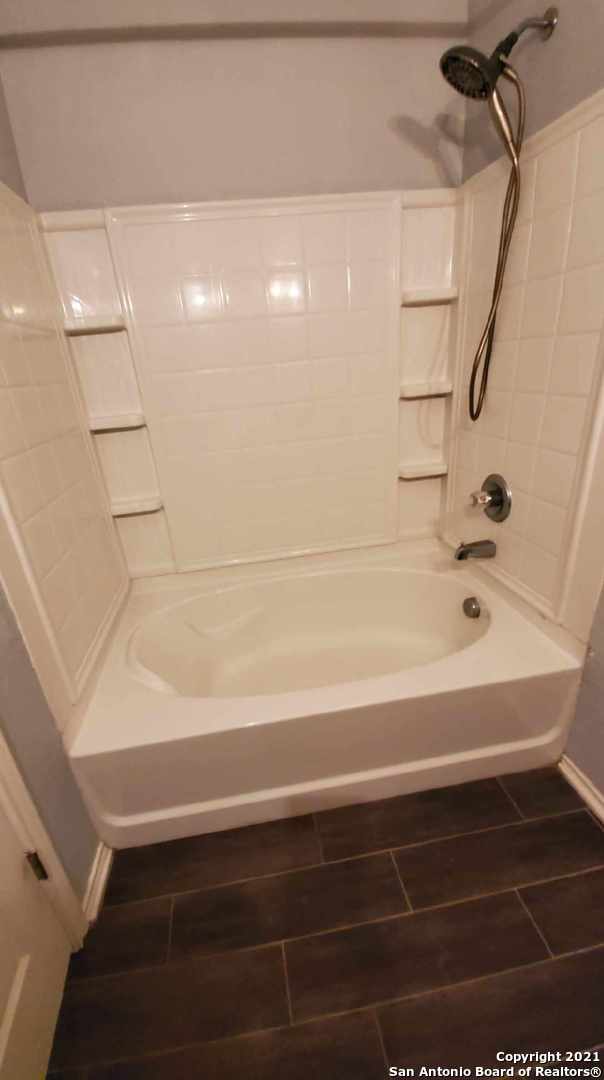 6307 Sentry Point San Antonio, TX 78233 - Photo 11 of 22 a bathroom with a bathtub