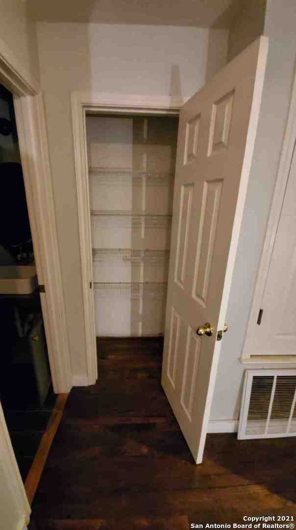 6307 Sentry Point San Antonio, TX 78233 - Photo 6 of 22 a view of a livingroom with wooden floor and staircase