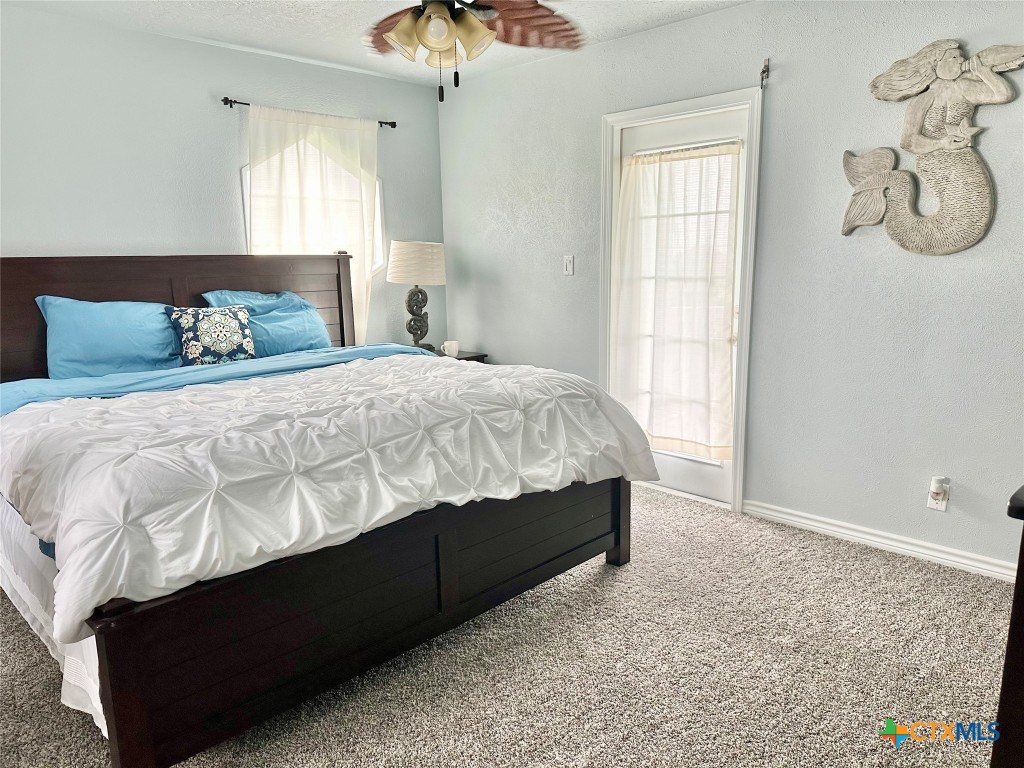 3109 Diane Street Port Bolivar, TX 77650 - Photo 12 of 17 a bedroom with a bed and window
