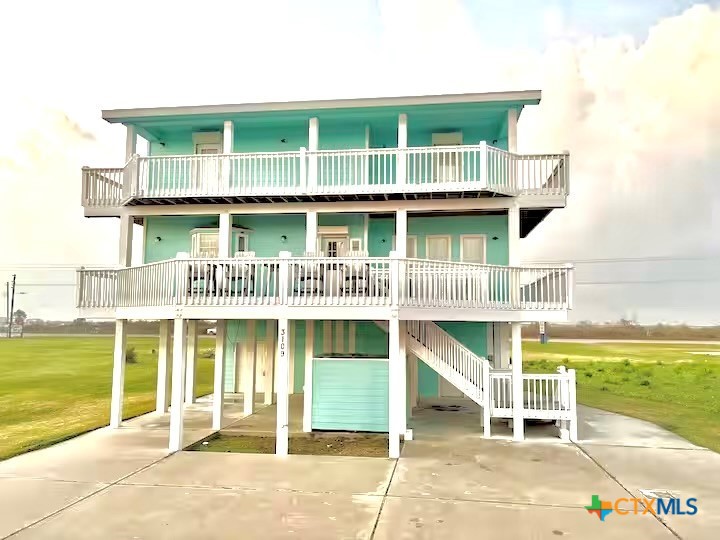 3109 Diane Street Port Bolivar, TX 77650 - Photo 2 of 17 a front view of a house with a porch