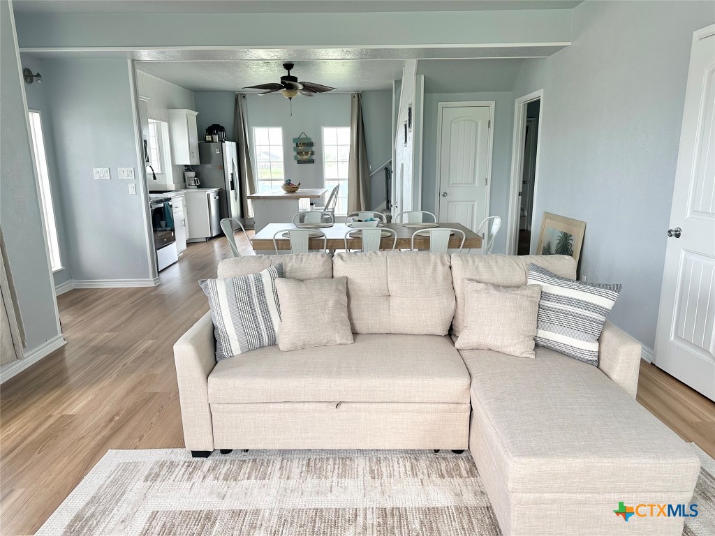 3109 Diane Street Port Bolivar, TX 77650 - Photo 6 of 17 a living room with furniture and a chandelier