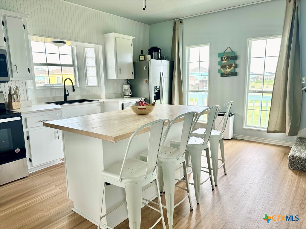 3109 Diane Street Port Bolivar, TX 77650 - Photo 8 of 17 a view of a dining room with furniture and wooden floor