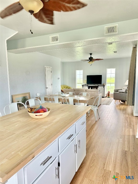 3109 Diane Street Port Bolivar, TX 77650 - Photo 9 of 17 a view of living room with kitchen island furniture and a flat screen tv