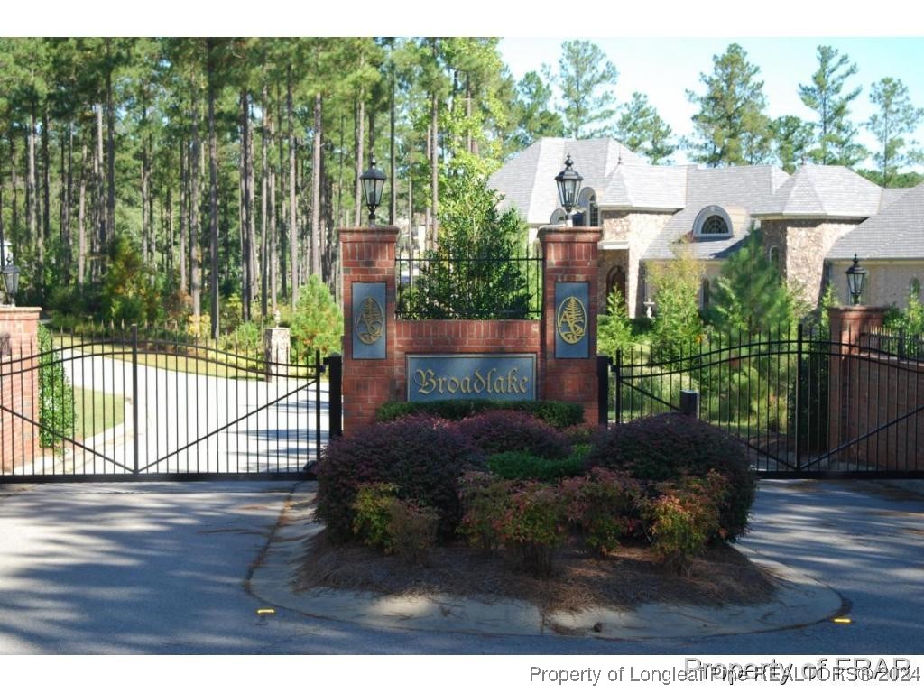 182 Broadlake Lane Spring Lake, NC 28390 - Photo 4 of 4 a view of a house with a yard and potted plants