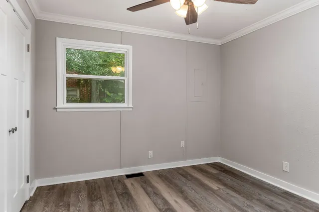 a view of an empty room with a window