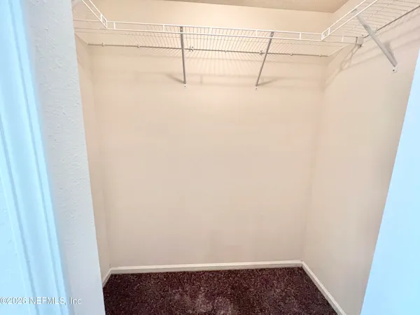 a bathroom with a sink a mirror and a vanity