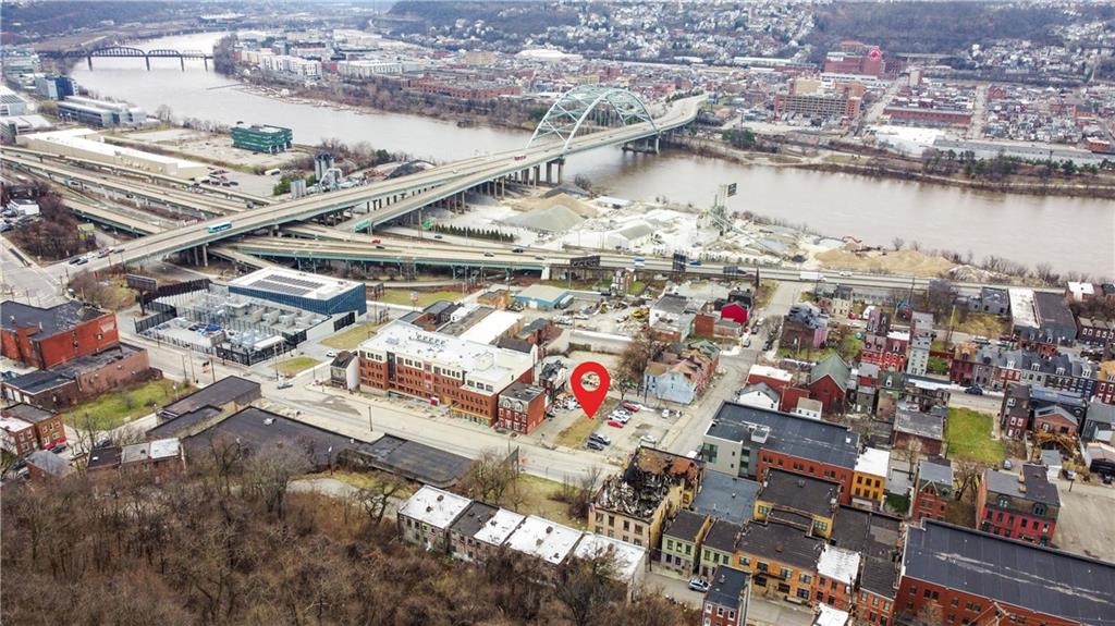 2106 Fifth Avenue Pittsburgh, PA 15219 - Photo 11 of 12 an aerial view of city and lake with trees all around