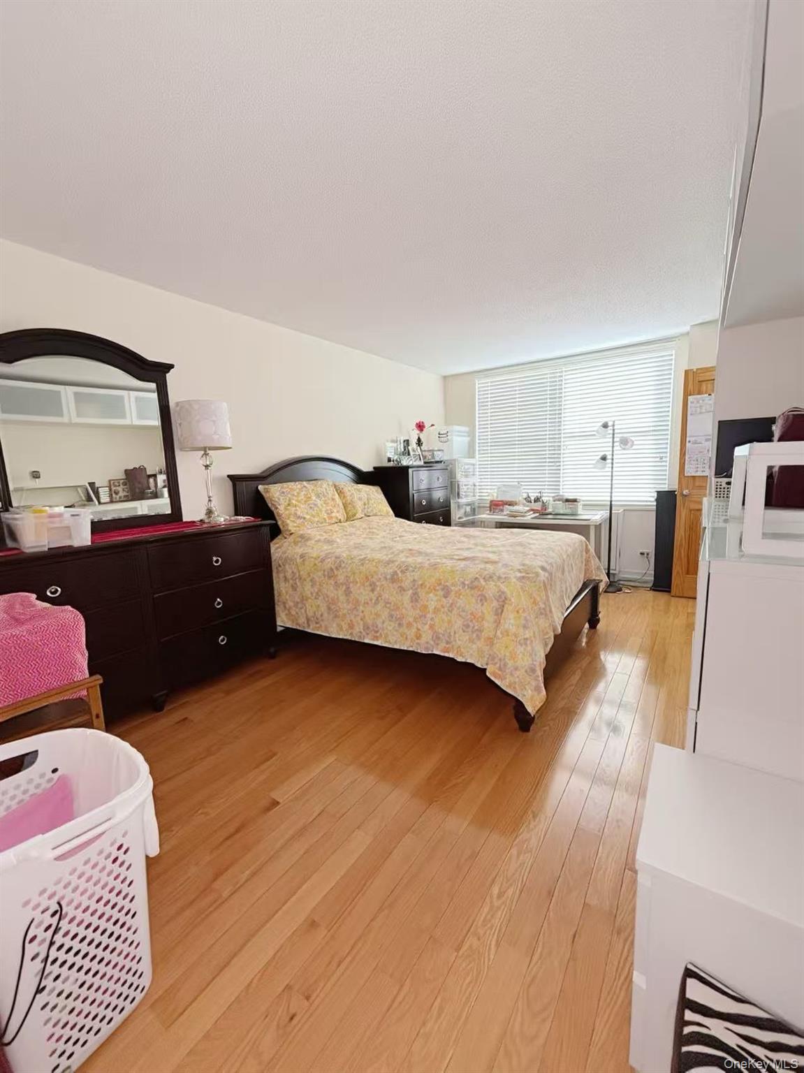 41-40 Union Street, Unit 6D Queens, NY 11355 - Photo 8 of 12 a bedroom with a bed and window