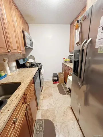 a view of kitchen with sink and washing machine