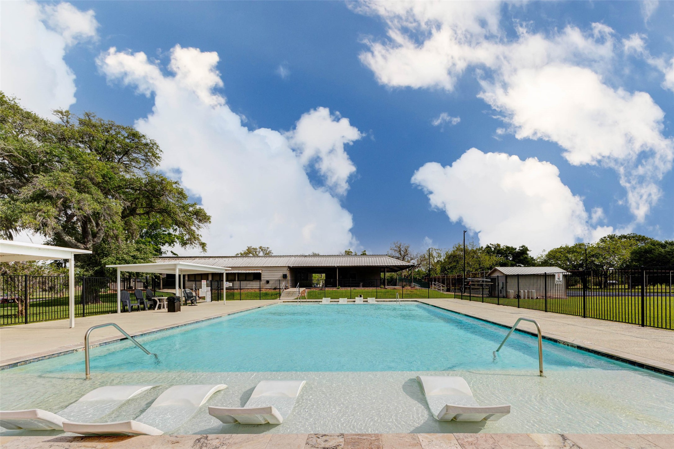 913 Buffalo Trail Angleton, TX 77515 - Photo 17 of 17 a view of a house with a swimming pool
