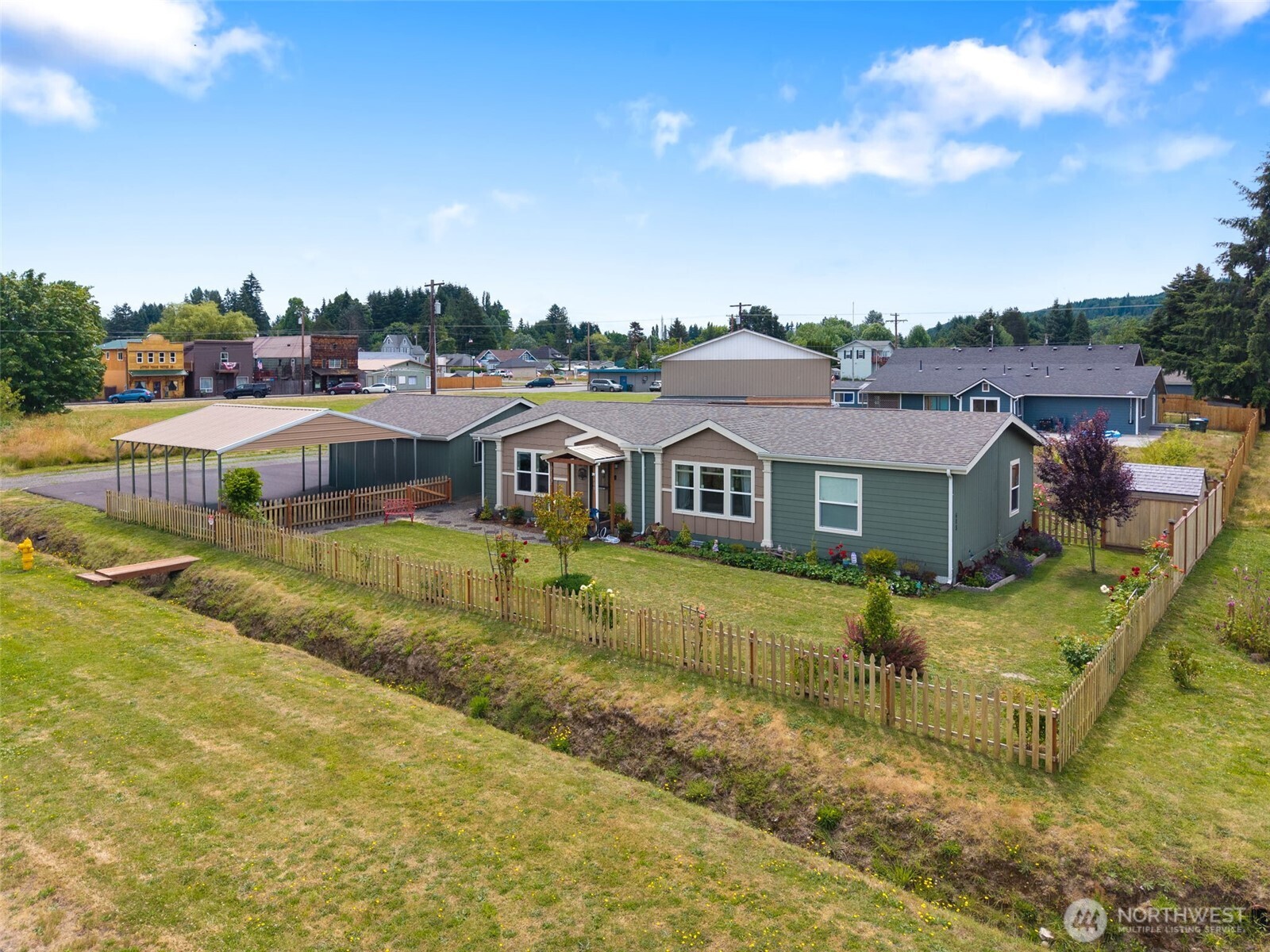 608 Main Street Vader, WA 98593 - Photo 31 of 37 a aerial view of a house with swimming pool and a yard
