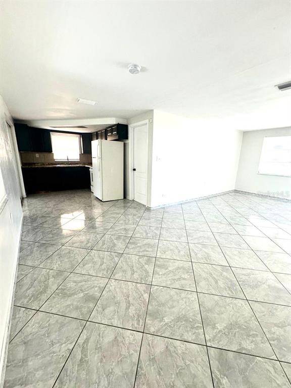 1019 Pert Lane Holiday, FL 34691 - Photo 4 of 12 a view of empty room with windows