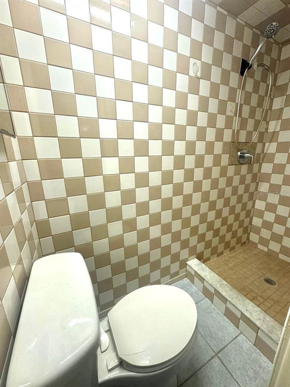 1019 Pert Lane Holiday, FL 34691 - Photo 7 of 12 a bathroom with a toilet and a sink