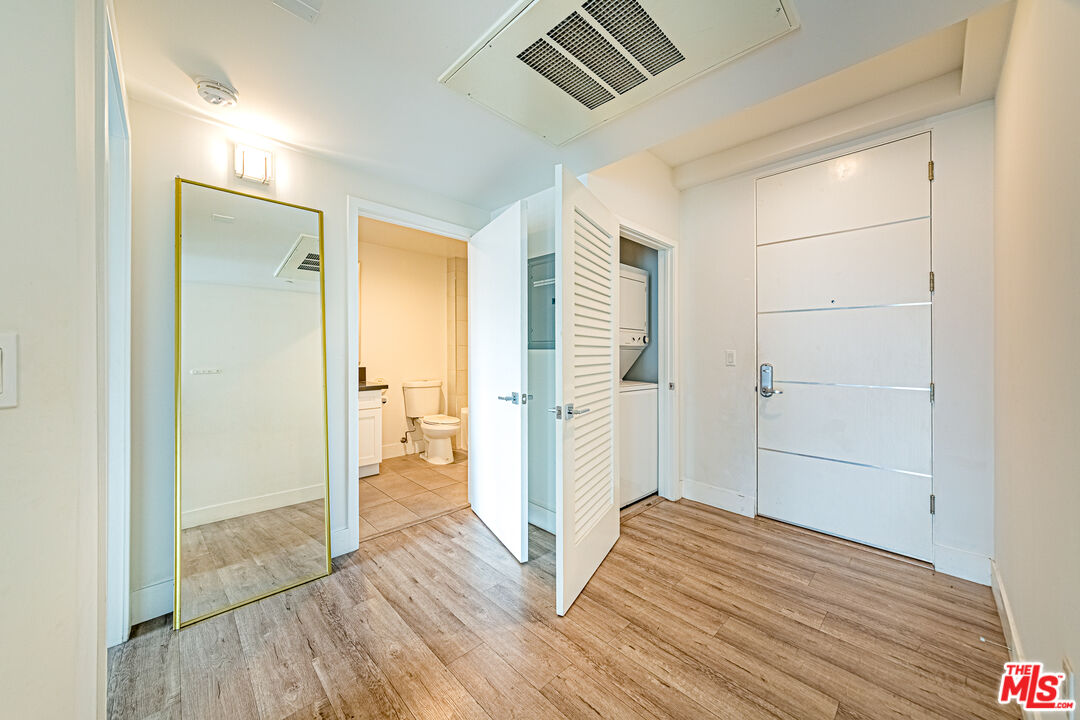 1101 South Harvard Boulevard, Unit 303 Los Angeles, CA 90006 - Photo 24 of 44 a view of empty room with wooden floor