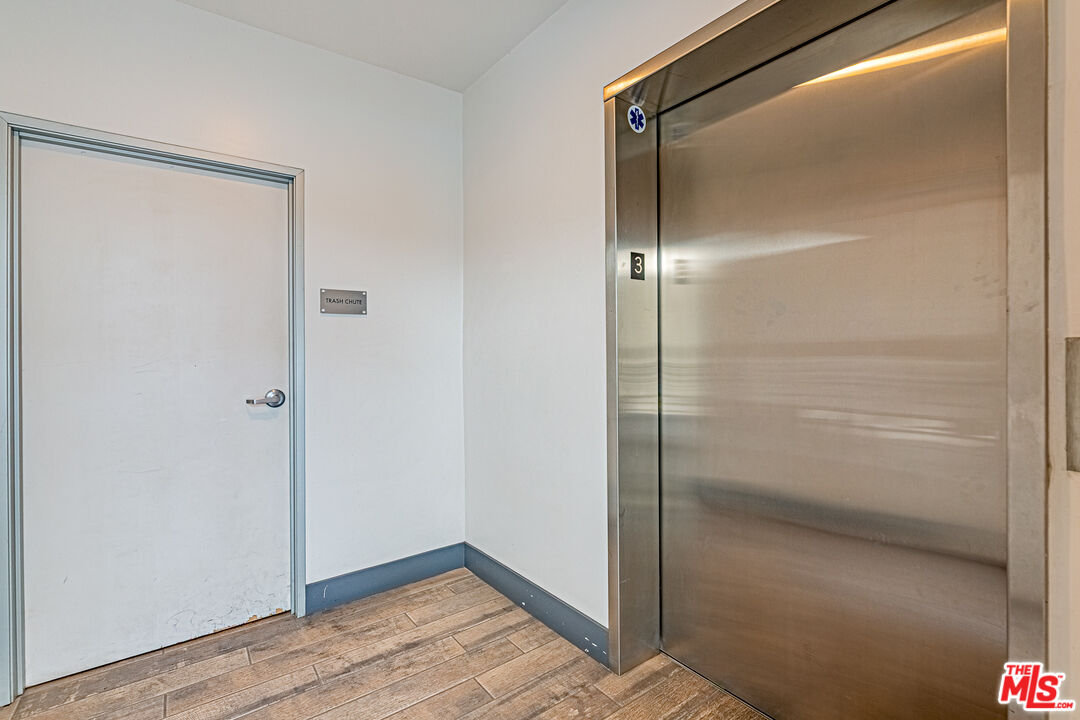 1101 South Harvard Boulevard, Unit 303 Los Angeles, CA 90006 - Photo 26 of 44 a bathroom with a glass shower door