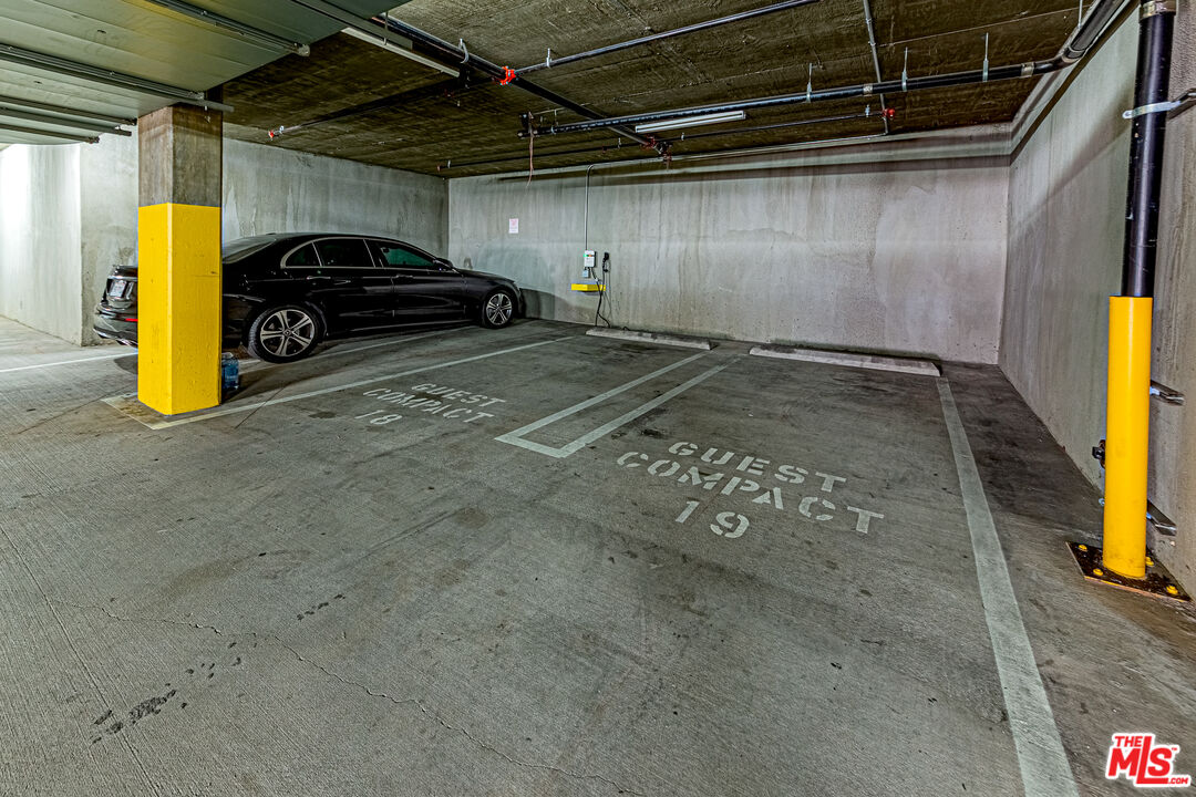 1101 South Harvard Boulevard, Unit 303 Los Angeles, CA 90006 - Photo 33 of 44 a car parked in a garage