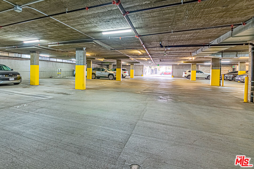 1101 South Harvard Boulevard, Unit 303 Los Angeles, CA 90006 - Photo 34 of 44 a view of a parking area