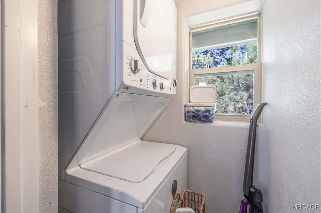 a view of a patio with couches table and chairs and potted plants