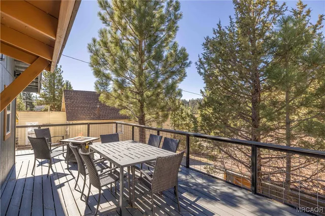 a patio with table and chairs