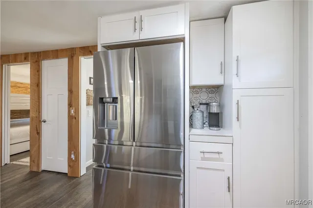 a bathroom with a shower and a glass door