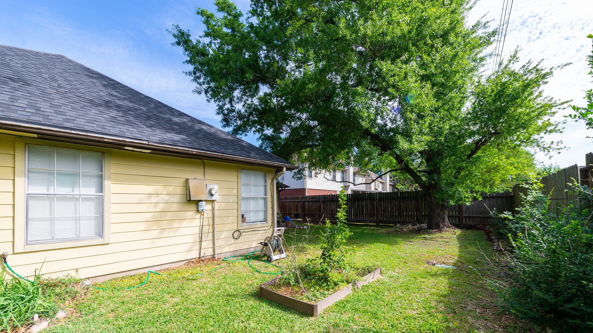 12203 Canterhurst Way Houston, TX 77065 - Photo 23 of 23 a front view of a house with garden